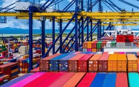 Consumer and lifestyle products — colourful containers stacked at a yard