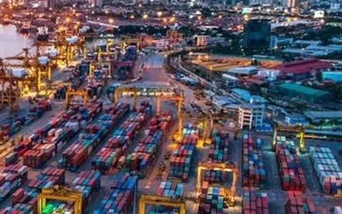 Business development — a port city trading hub at dusk
